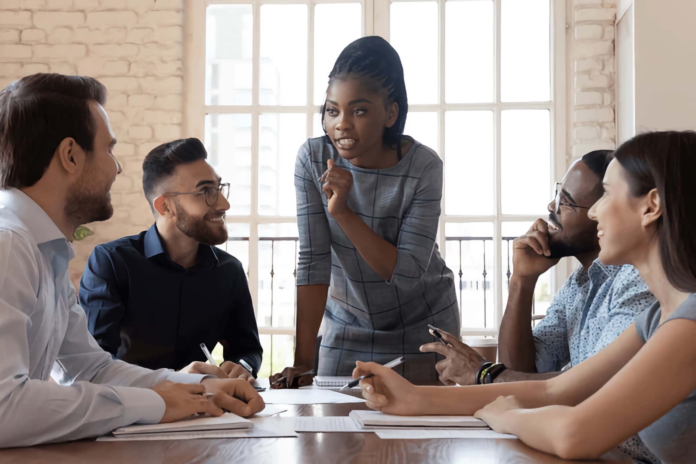 Inclusive leadership in action with a diverse team led by a Black woman