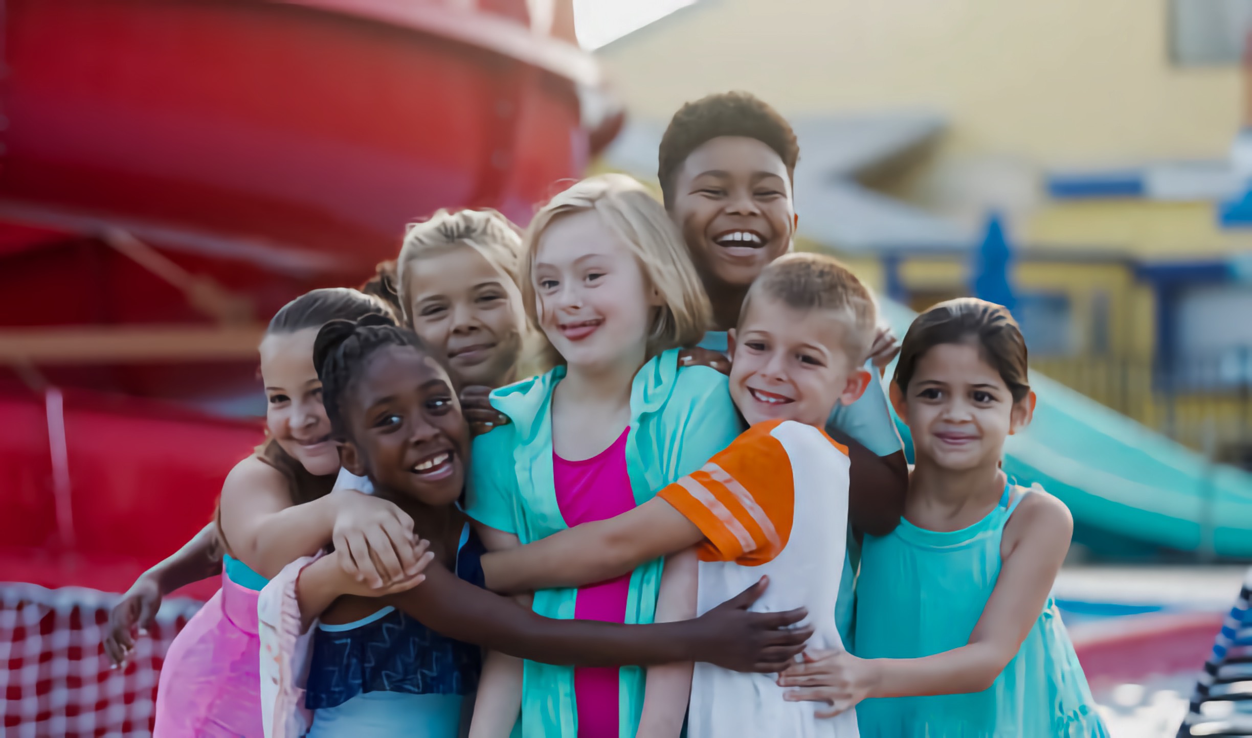 inclusive, diverse group of children in a group hug, including a child with an intellectual disability, embracing each other with warmth and affection.